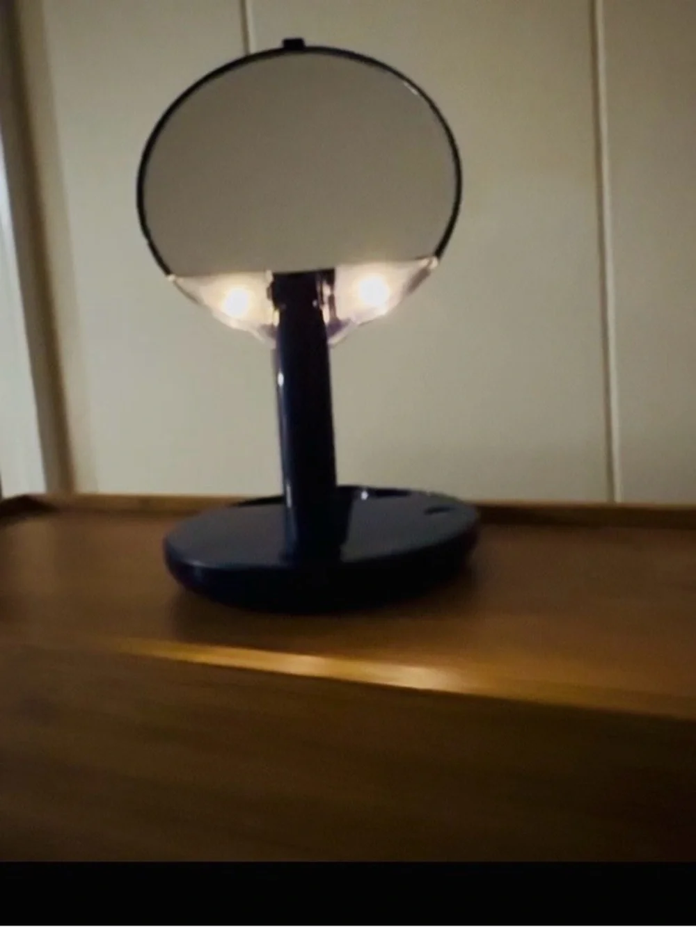 Blue Countertop Makeup Mirror, adjustable arm, lights on mirror.